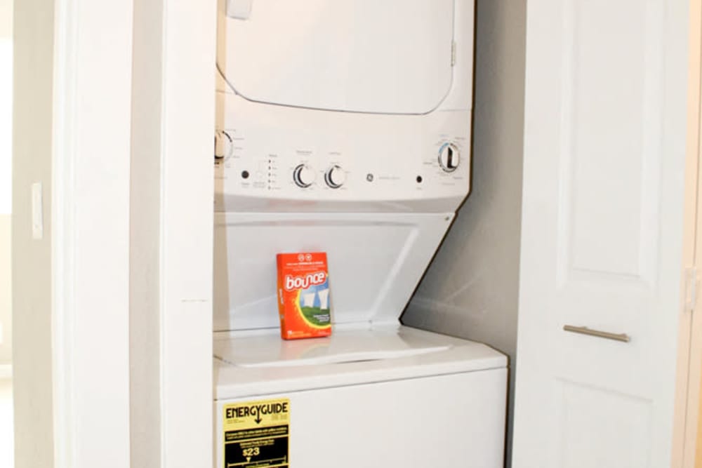 In-unit washer and dryer with extra linen storage at Creekside Gardens in Vacaville, California