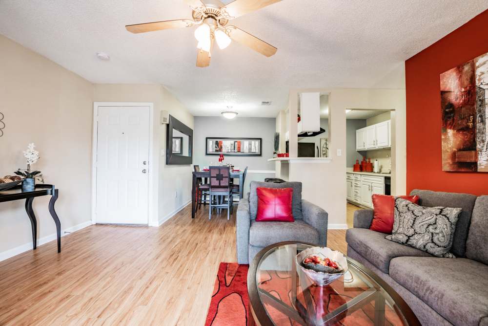 Open floor plan apartment with living room and dining area at Waterstone At Carrollwood in Tampa, Florida