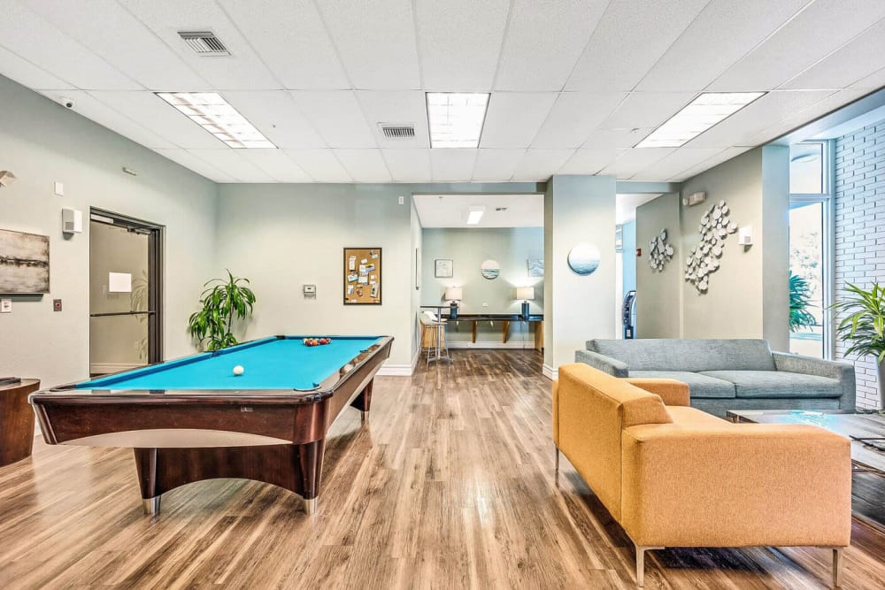 Resident lounge with seating and billiards at Elements on Third in St Petersburg, Florida