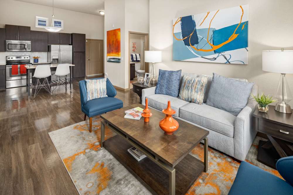 Open concept apartment with living room and kitchen at Station House at Lake Mary in Lake Mary, Florida