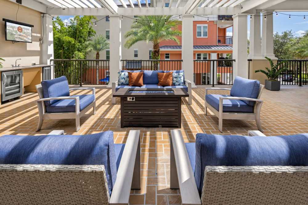 Patio lounge with electric firepit at Station House at Lake Mary in Lake Mary, Florida