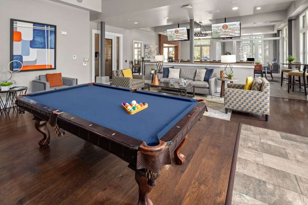 Community clubhouse with pool table at Station House at Lake Mary in Lake Mary, Florida