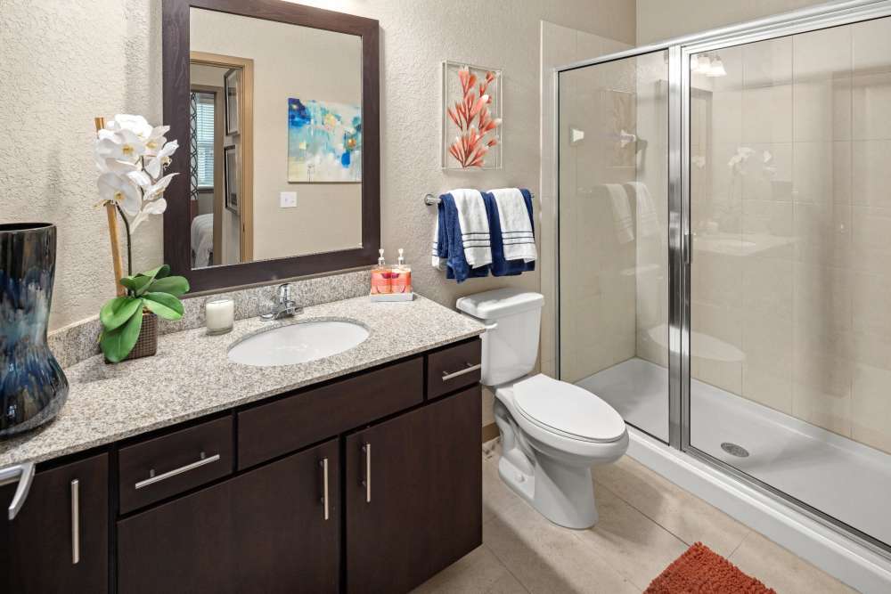 Apartment bathroom with full shower at Station House at Lake Mary in Lake Mary, Florida
