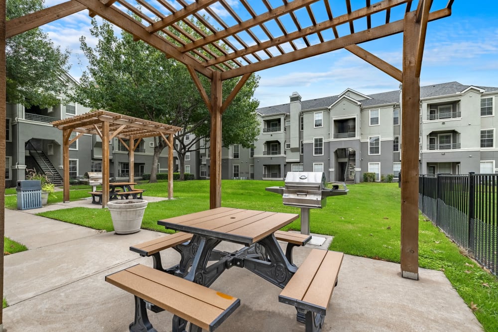 Outdoor Grilling stations and picnic tables at Marquis at Stonegate in Fort Worth, Texas