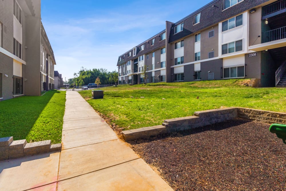 Exterior view and pathways of Midtown at Coppin Heights in Baltimore, Maryland