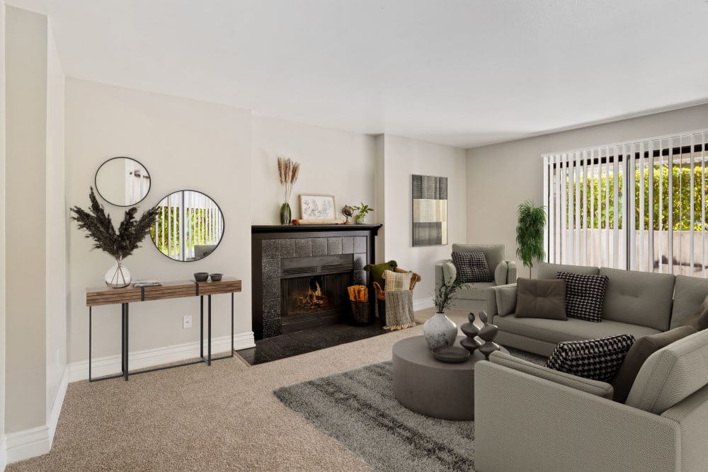 Living room and a fireplace at Royal Ridge Apartments in Midvale, Utah