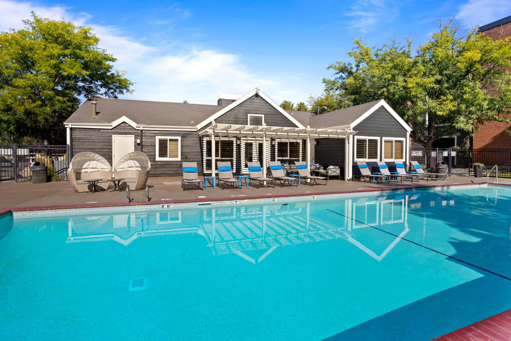 Poolside Loungers and Resort Pool at Royal Ridge Apartments in Midvale, Utah