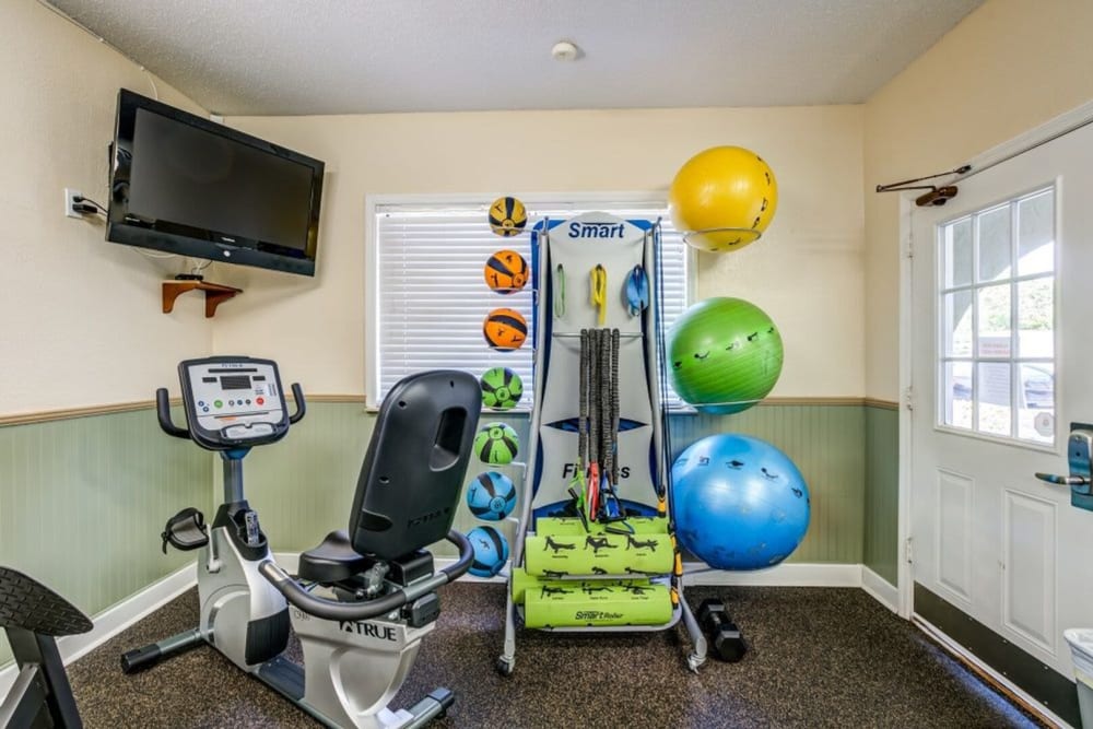 Community fitness center with stationary bike at Garden Grove in Sarasota, Florida
