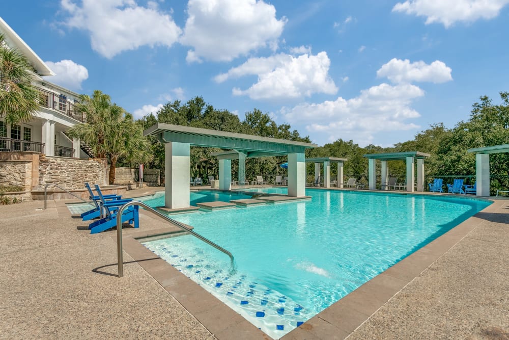 Swimming pool with seating at The Anthony at Canyon Springs in San Antonio, Texas