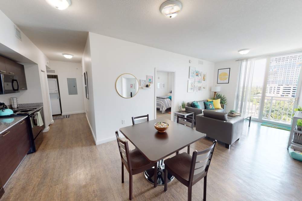 Apartment dining area near the living room at 109 Tower in Miami, Florida