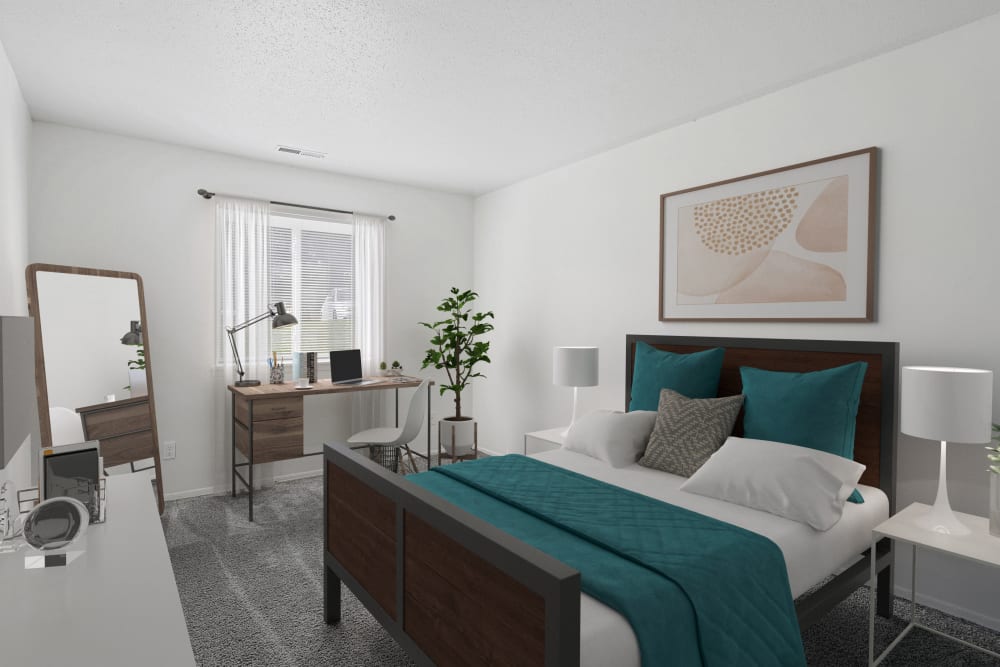 A furnished bedroom in a home at Arbors of Battle Creek Apartments & Townhomes in Battle Creek, Michigan