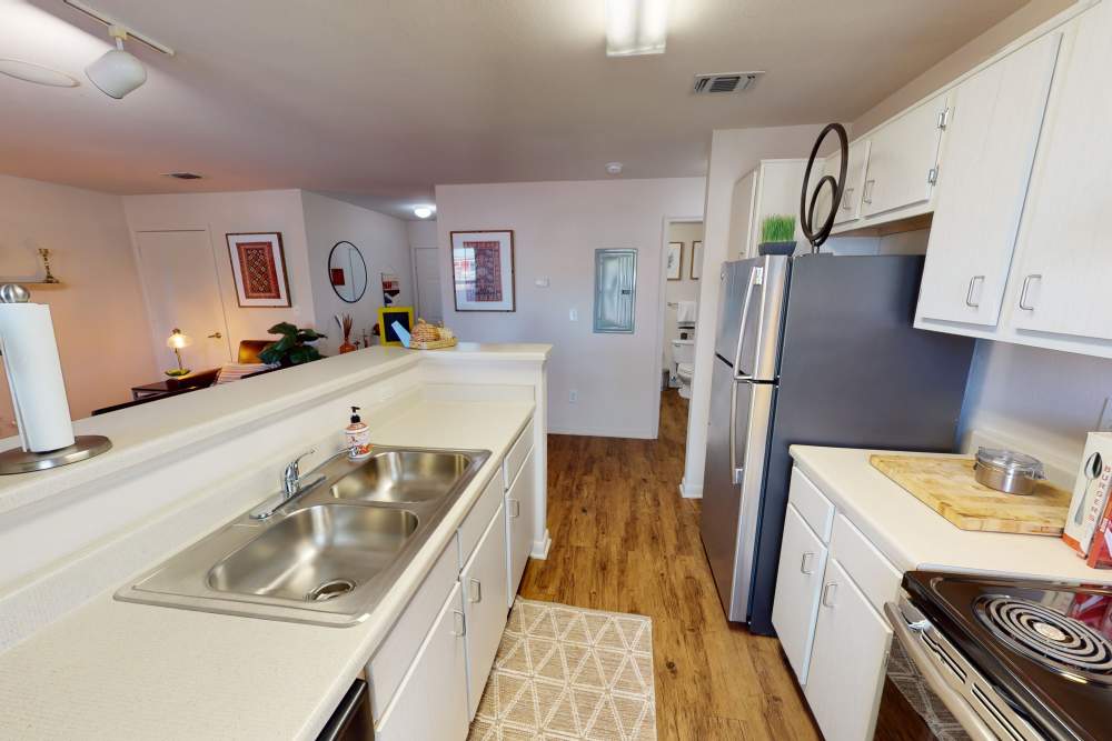 Apartment kitchen with double basin sink at The Quarters at Lincoln in Lincoln, Nebraska