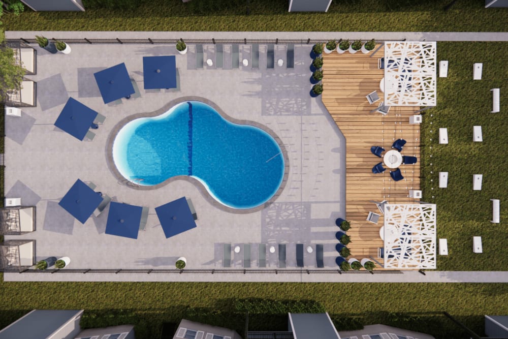 Aerial view of our swimming pool and outdoor lounge chairs at The Emory in Pensacola, Florida