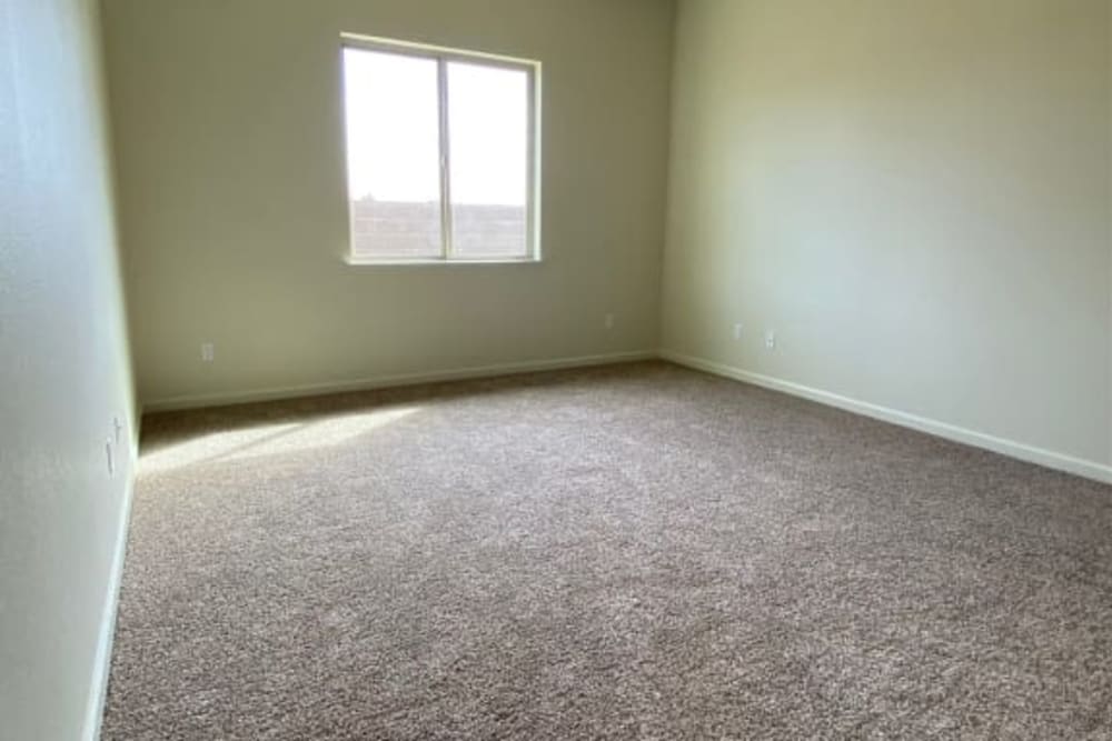 Bedroom with carpet at Wisdom Place in Modesto, California