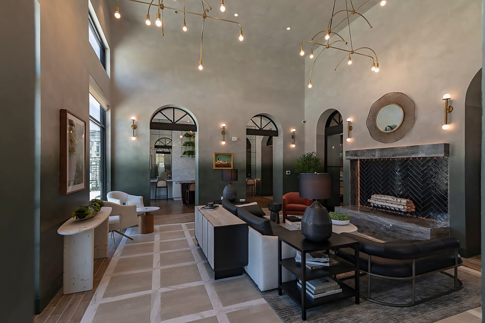 Beautiful living room and kitchen with fireplace at Auro Crossing in Austin, Texas