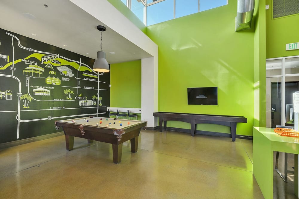Pool table and shuffleboard in the resident lounge at Onnix in Tempe, Arizona