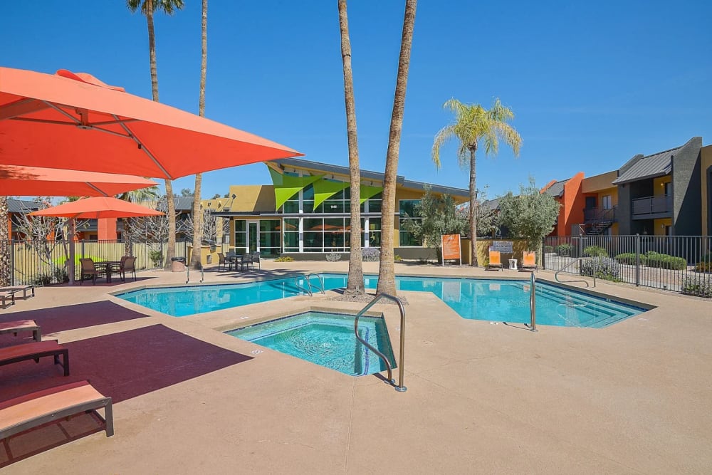 Resort-style swimming pool surrounded by lounge chairs at Onnix in Tempe, Arizona