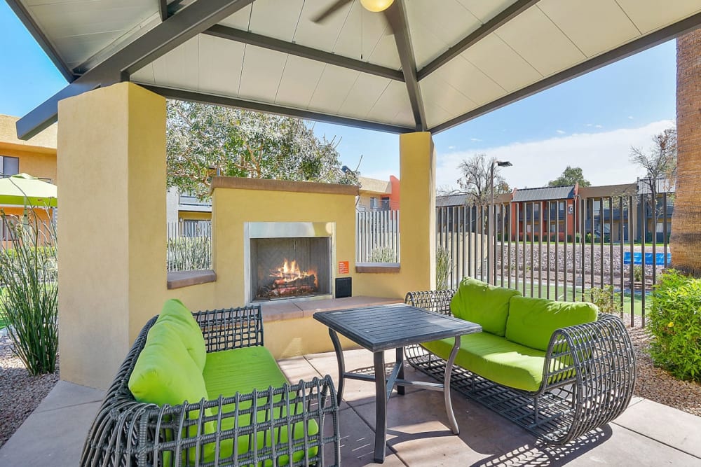 Outdoor lounge with a fireplace at Onnix in Tempe, Arizona