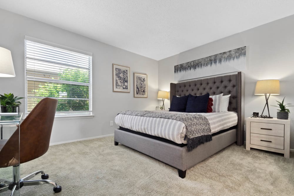 Model bedroom with soft carpet at The Carling on Frankford in Carrollton, Texas