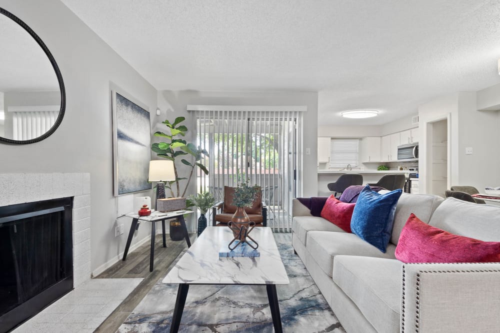 A bright living room in a furnished apartment at The Carling on Frankford in Carrollton, Texas