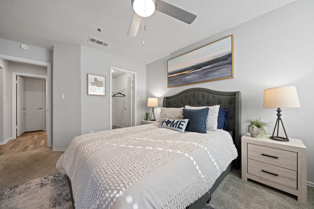 Bedroom with white sheets at Somerset in Lewisville, Texas
