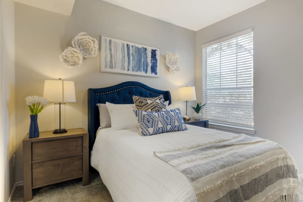Master bedroom with soft carpet at Keystone Falls in Dallas, Texas