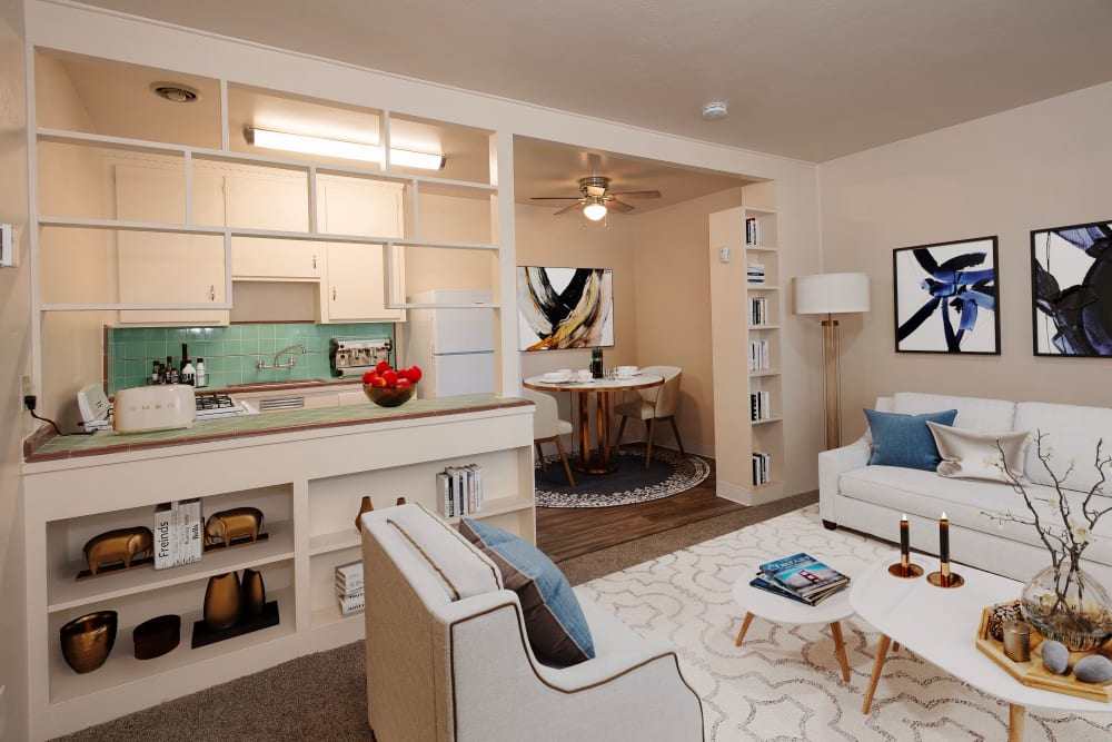 Kitchen and living room area at Coralaire Apartments in Sacramento, California