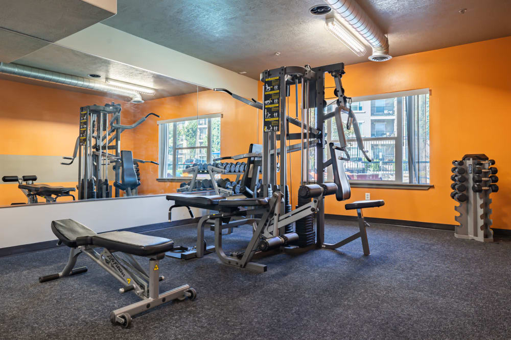 Fitness center with a variety of equipment at Meadowbrook Station Apartments in Salt Lake City, Utah.