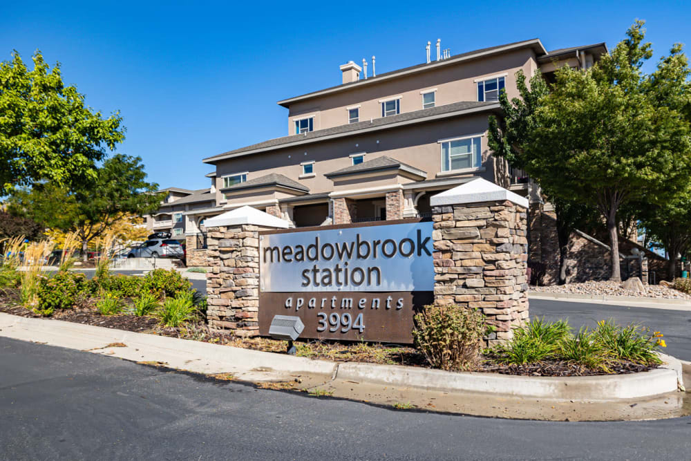 Entrance signage at Meadowbrook Station Apartments in Salt Lake City, Utah
