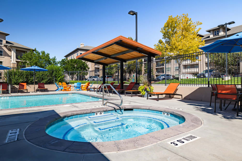Outdoor community pool and spa at Meadowbrook Station Apartments in Salt Lake City, Utah