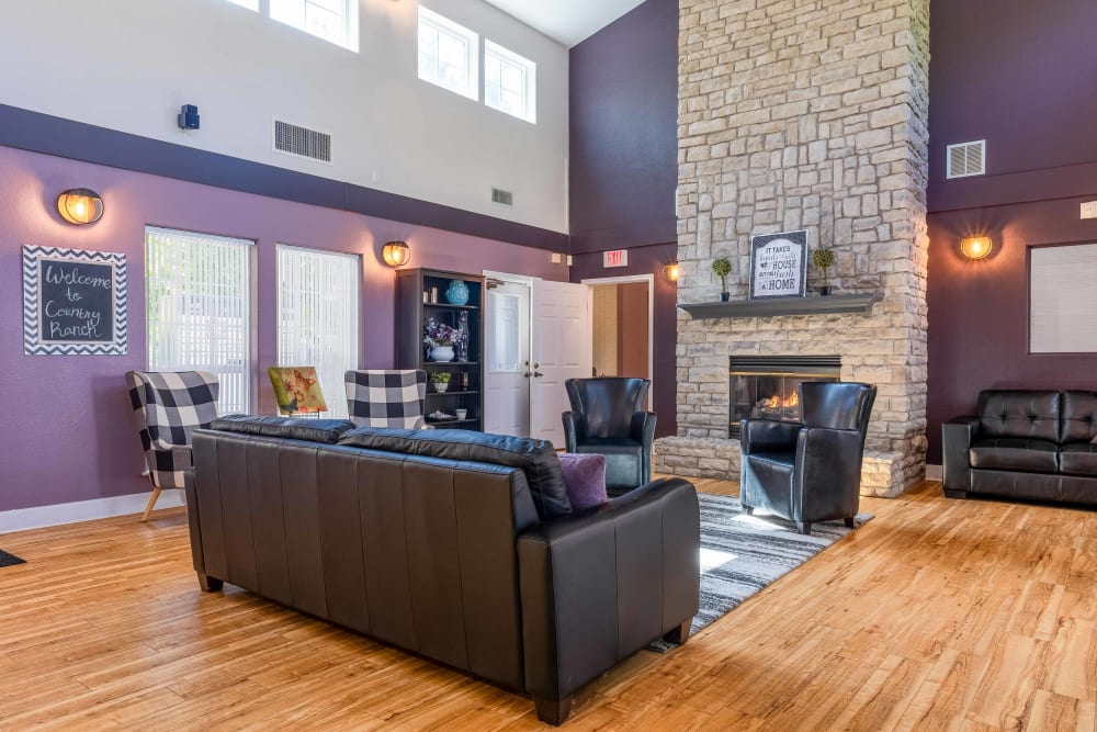 Fireplace and comfortable sitting area inside leasing office at Country Ranch Apartments in Fort Collins, Colorado