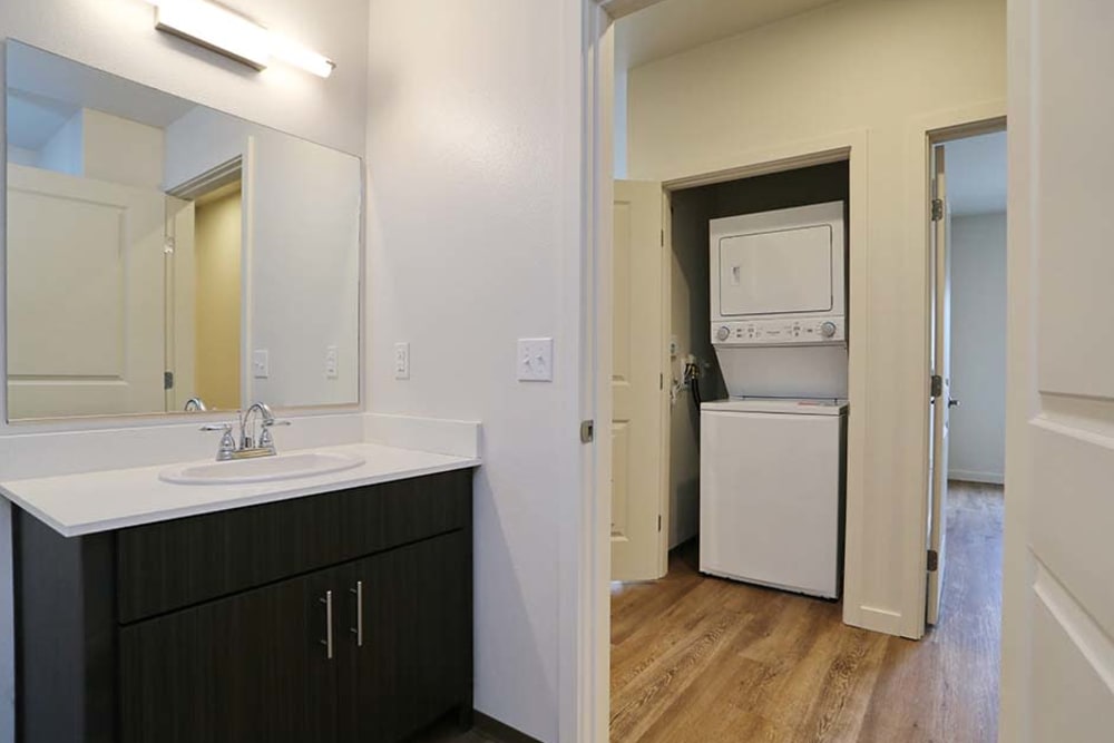In-unit washer and dryer with extra linen storage at Cedar Pointe in Arlington, Washington