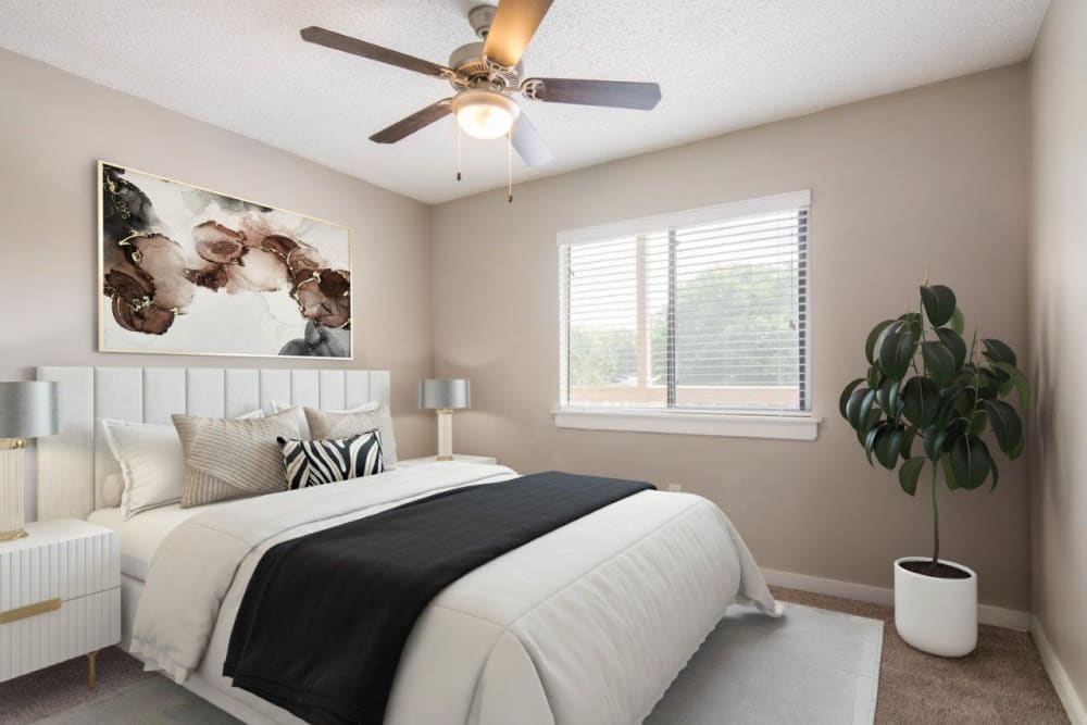 Bright white bedroom at 1022 West apartments