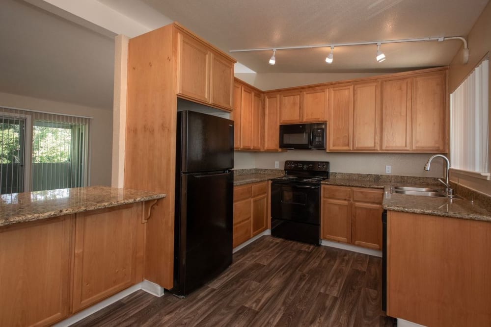 Well-lit kitchen at Castle Hill Apartments in Sacramento, California