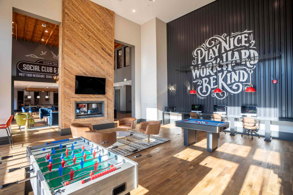 Interior of community clubhouse at Bluebird Row in Chattanooga, Tennessee featuring foosball table, and other entertainment.