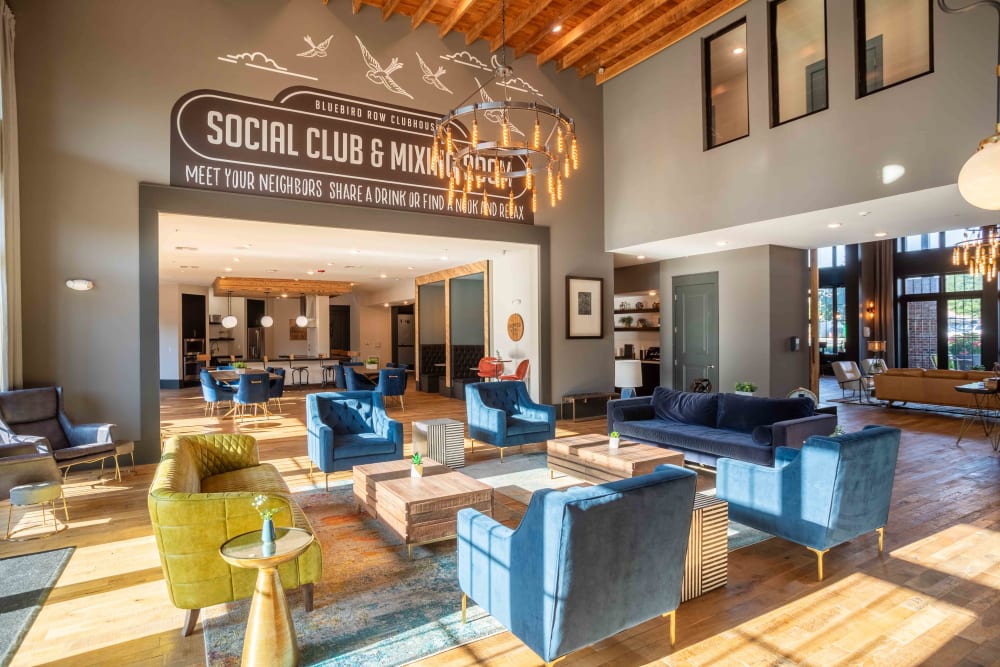 Interior of leasing office at Bluebird Row in Chattanooga, Tennessee features tall ceilings and comfortable sitting areas.