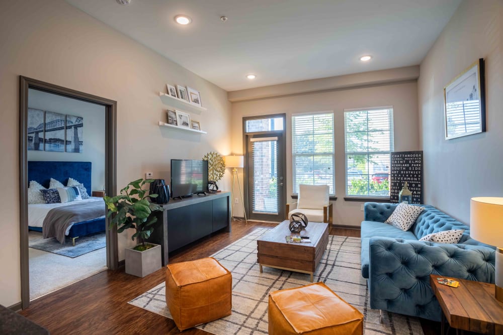 Living room with large windows for natural light at Bluebird Row in Chattanooga, Tennessee