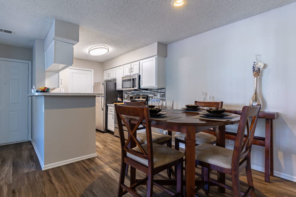Kitchen and dining table space at Mountain View Apartment Homes in Colorado Springs, Colorado