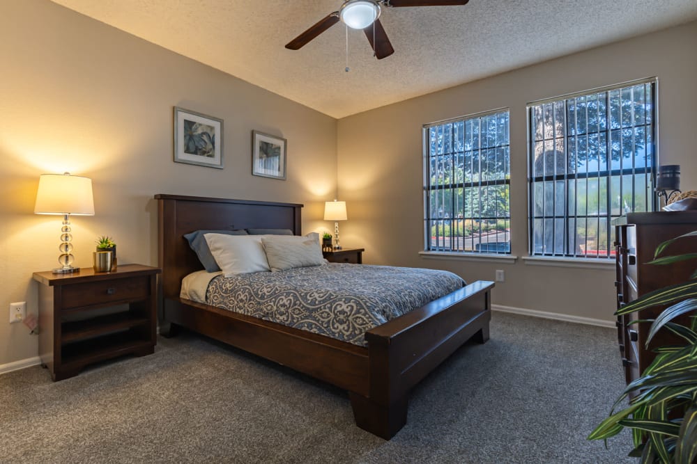 Bedroom with a ceiling fan at Mountain View Apartment Homes in Colorado Springs, Colorado