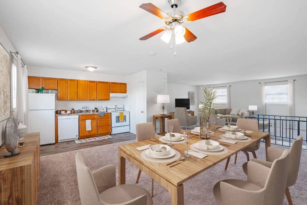 Dining Room with kitchen in the background at Vineland Village Apartment Homes in Vineland, New Jersey