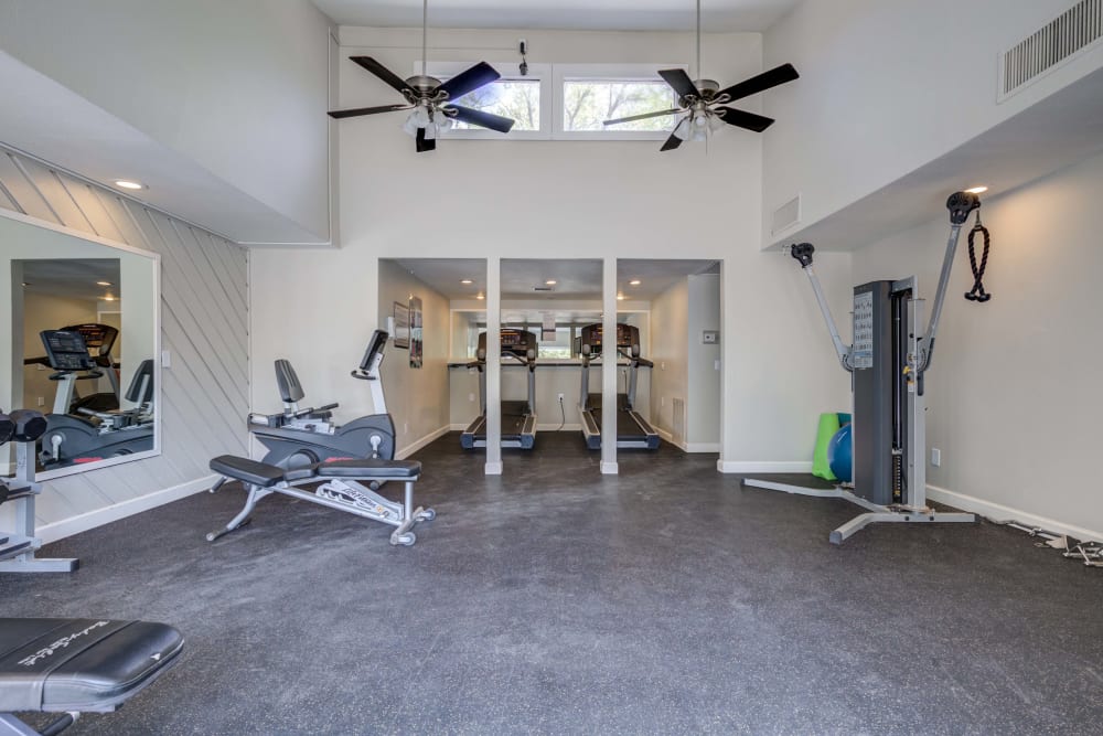 Fitness Center with fans for ventilation and high ceilings at The Knolls at Sweetgrass Apartment Homes in Colorado Springs, Colorado