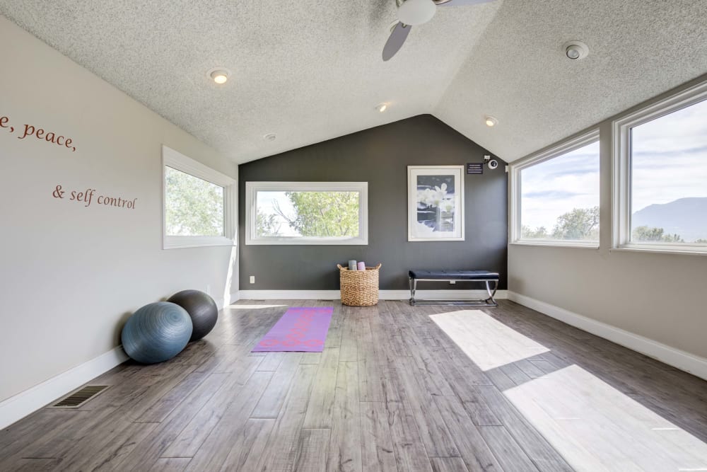 Movement studio with exercise balls and a lot of windows for ample natural light in Fitness Center at The Knolls at Sweetgrass Apartment Homes in Colorado Springs, Colorado.