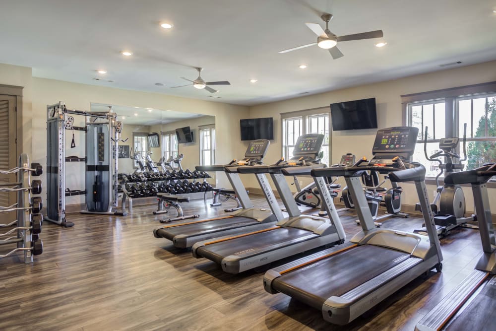 Fitness center featuring treadmill's and other workout equipment at The Retreat at Arden Village Apartments in Columbia, Tennessee