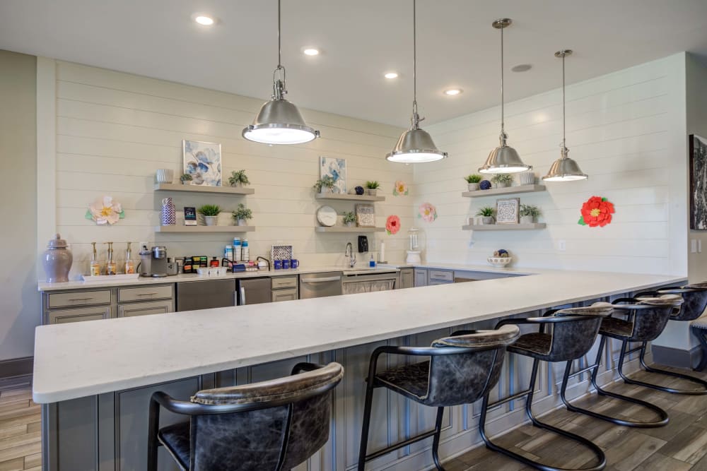 Bar style seating at clubhouse community kitchen area at Apartments in Columbia, Tennessee