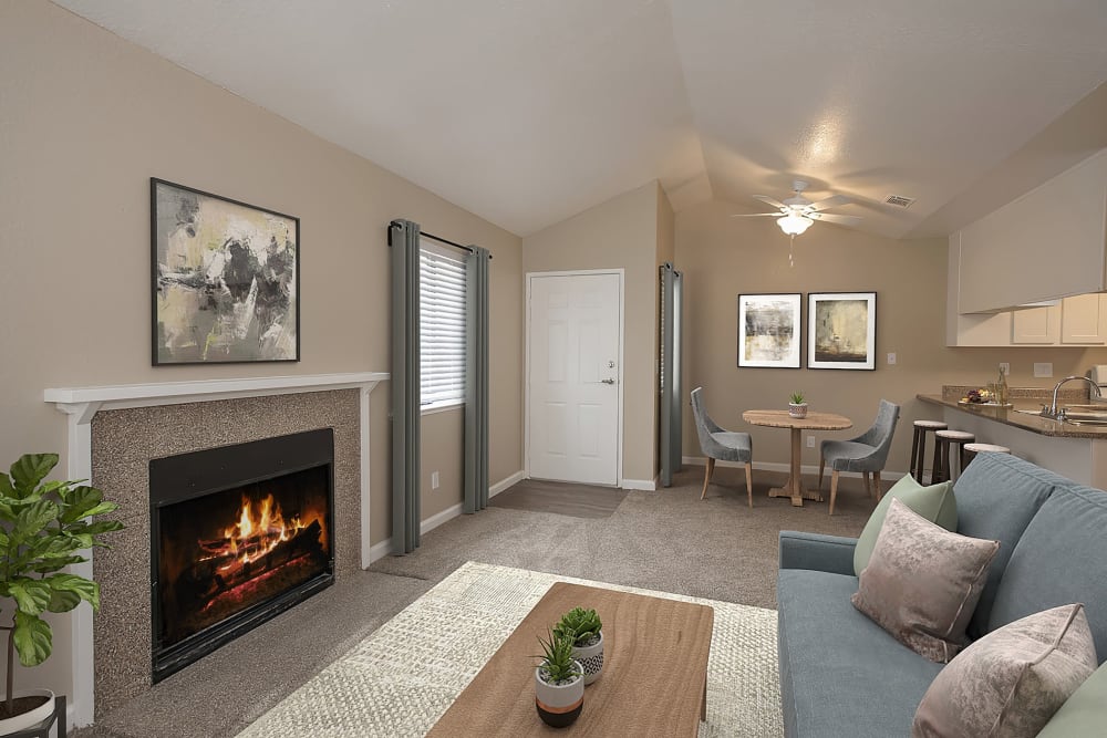 Living room with fireplace at River's Edge Apartments in Lodi, California