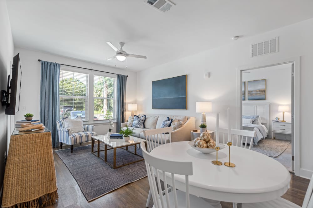 Spacious living room and a dining table at The Griffon Vero Beach | Apartments in Vero Beach, Florida