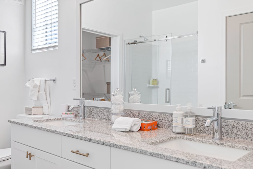 A bathroom with double sinks at The Griffon Vero Beach | Apartments in Vero Beach, Florida