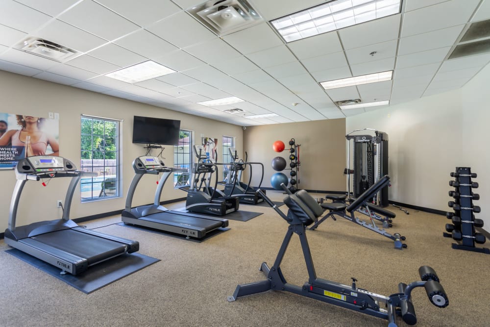 Well-equipped fitness center with cardio equipment at Jackson Grove Apartment Homes in Hermitage, Tennessee