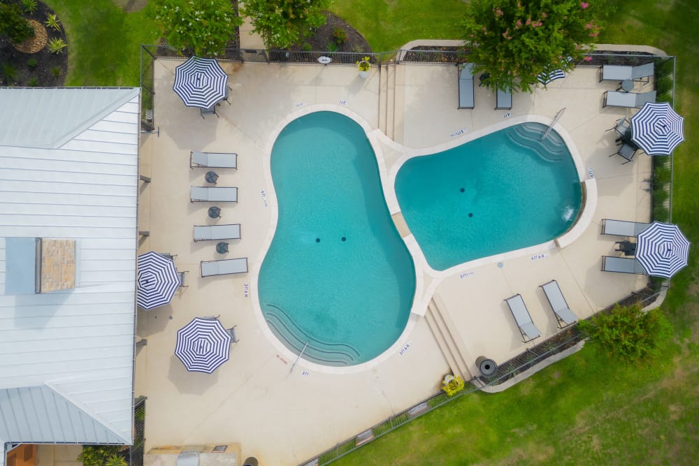 Drone shot of the pool  at Leander Apartment Homes in Benbrook, Texas