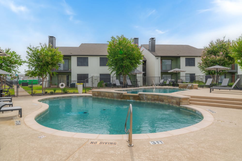 Swimming pool  at Leander Apartment Homes in Benbrook, Texas